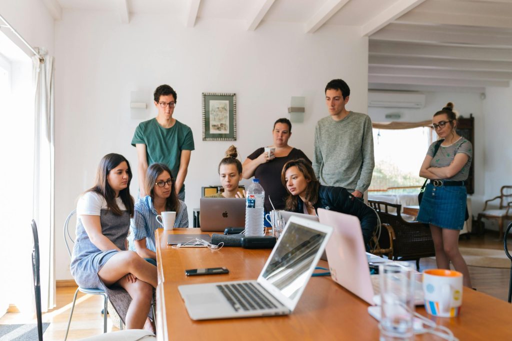 a group of people around a table a group of people around a table